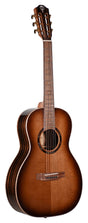 The image shows a beautiful classical acoustic guitar with a sunburst finish, solid spruce top, and dark wood back and sides with decorative binding. It features a clean neck with a rosewood fretboard, traditional headstock with gold tuning pegs in a 3+3 layout, a round sound hole with a decorative rosette, and a classical-style bridge for nylon strings. The guitar appears well-crafted and mid to high-end.