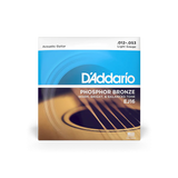 The image shows a package of D'Addario EJ16 Phosphor Bronze acoustic guitar strings in light gauge (.012-.053). The blue and orange packaging features an acoustic guitar sound hole. These strings offer a warm, bright, and balanced tone with longer durability due to phosphor content. Light gauge strings provide easier playability and bending, ideal for beginners and experienced players seeking lower string tension.