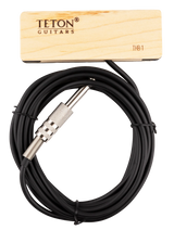 The image shows a TETON Guitars THB-1 soundhole pickup for acoustic guitars. It features a wooden mounting block with branding, a black cable, and a 1/4" instrument jack. Designed to capture string vibrations and amplify the acoustic sound, its wooden housing blends with the guitar’s natural wood, making it a practical accessory for amplified acoustic performances.