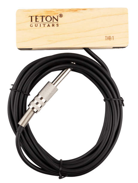 The image shows a TETON Guitars THB-1 soundhole pickup for acoustic guitars. It features a wooden mounting block with branding, a black cable, and a 1/4" instrument jack. Designed to capture string vibrations and amplify the acoustic sound, its wooden housing blends with the guitar’s natural wood, making it a practical accessory for amplified acoustic performances.