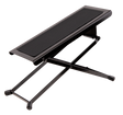The image shows a guitar footstool with a black metal X-shaped folding frame, a padded cushioned top, adjustable height, and rubber feet for stability. It’s designed for classical and acoustic guitarists to elevate the left foot, promoting proper posture and better control. Portable and foldable, it’s a common accessory in music schools, concert halls, and practice rooms.