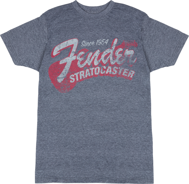 The image shows a heather gray Fender t-shirt featuring vintage-style graphics celebrating the iconic Fender Stratocaster guitar. The design includes "Since 1954," large "Fender" script, bold "STRATOCASTER" text, and a stylized guitar silhouette. This music merchandise appeals to fans and musicians, honoring one of the most influential electric guitars in history.