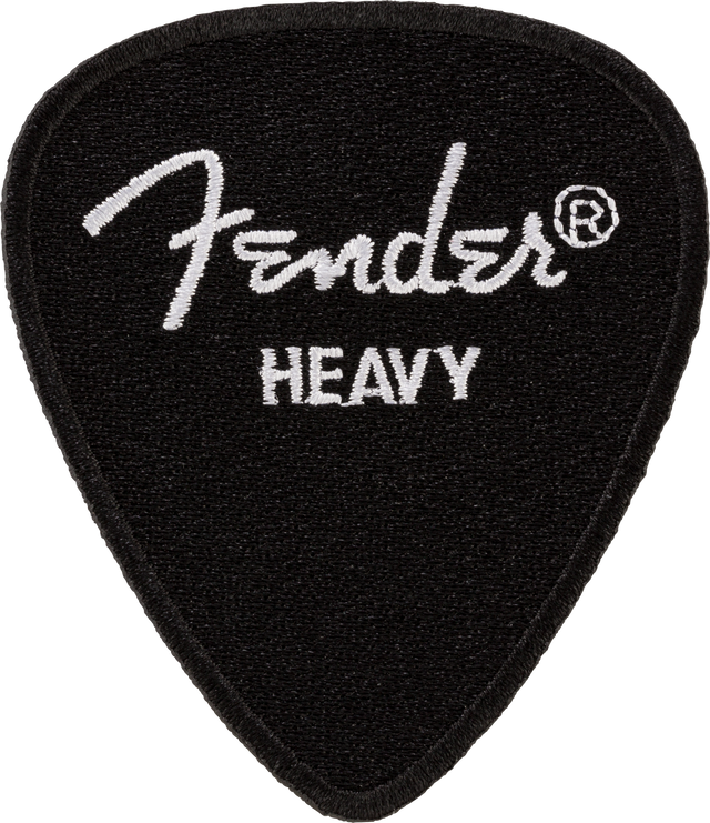 The image shows a black Fender guitar pick with a textured surface and the white Fender logo along with the registered trademark symbol. It is marked "HEAVY," indicating a thicker pick preferred for rigidity and control, popular among lead guitarists and single-note players. Fender is a well-known brand in guitars and accessories.