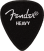 The image shows a black Fender guitar pick with a textured surface and the white Fender logo along with the registered trademark symbol. It is marked "HEAVY," indicating a thicker pick preferred for rigidity and control, popular among lead guitarists and single-note players. Fender is a well-known brand in guitars and accessories.
