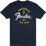 The image shows a navy blue Fender t-shirt featuring the iconic Fender logo. The design includes yellow "CALIFORNIA" text, the classic white Fender script, a small vintage-style skeleton guitarist graphic, "USA," and "EST. 1946." This branded apparel represents Fender, a legendary guitar and amplifier maker founded in California in 1946, popular among musicians and music fans.