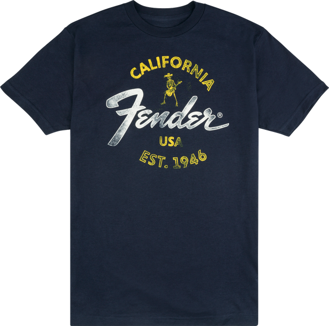 The image shows a navy blue Fender t-shirt featuring the iconic Fender logo. The design includes yellow "CALIFORNIA" text, the classic white Fender script, a small vintage-style skeleton guitarist graphic, "USA," and "EST. 1946." This branded apparel represents Fender, a legendary guitar and amplifier maker founded in California in 1946, popular among musicians and music fans.