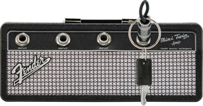 The image shows a compact Fender Mini Twin Amp keychain styled like a miniature guitar amplifier head. It features the Fender logo, “Mini Twin Amp” text, three 1/4" input jacks labeled "INPUT," and classic Fender design with silver sparkle grille and black tolex. This small, portable item resembles Fender’s Twin Reverb amps and is often used as a collectible, practice tool, or novelty accessory.