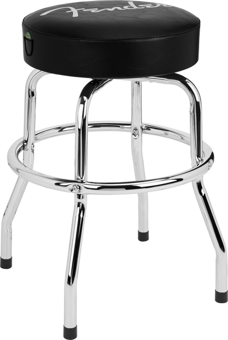 The image shows a Fender barstool with a round, padded black vinyl seat featuring the white Fender logo. It has a chrome steel frame with four legs, a circular footrest, and rubber caps on the feet to protect floors. Styled like a classic diner stool, it’s popular among musicians for practice or studios, combining functionality with iconic Fender branding.