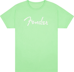 The image shows a light green t-shirt with the iconic white "Fender" logo across the chest. Fender is a legendary musical instrument brand known for classic electric guitars like the Stratocaster and Telecaster, as well as amplifiers. This official Fender apparel allows musicians and fans to express their connection to the brand beyond instruments.