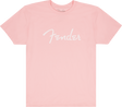 The image shows a pink/coral t-shirt with the white "Fender" logo prominently displayed across the front and a smaller logo at the neck tag. This branded apparel is from Fender, the iconic guitar and amplifier maker known for classic instruments like the Stratocaster and Telecaster, popular among musicians and fans since 1946.