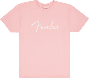 The image shows a pink/coral t-shirt with the white "Fender" logo prominently displayed across the front and a smaller logo at the neck tag. This branded apparel is from Fender, the iconic guitar and amplifier maker known for classic instruments like the Stratocaster and Telecaster, popular among musicians and fans since 1946.
