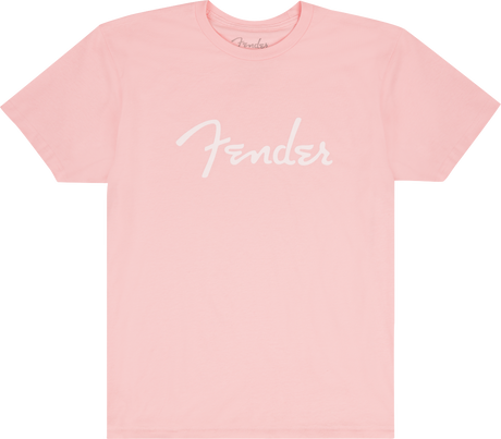 The image shows a pink/coral t-shirt with the white "Fender" logo prominently displayed across the front and a smaller logo at the neck tag. This branded apparel is from Fender, the iconic guitar and amplifier maker known for classic instruments like the Stratocaster and Telecaster, popular among musicians and fans since 1946.