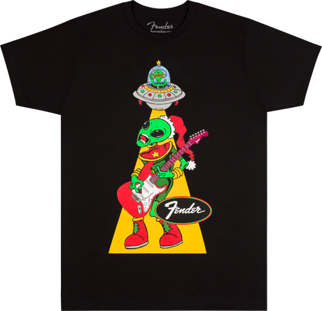 The image shows a black Fender t-shirt featuring a whimsical green alien wearing a Santa hat, playing a Fender Stratocaster guitar. The alien is being "abducted" by a UFO via a tractor beam. The classic Fender logo appears below the cartoon-style design. This playful, holiday-themed shirt combines Fender’s iconic guitar branding with sci-fi and festive elements, popular among musicians and guitar fans.