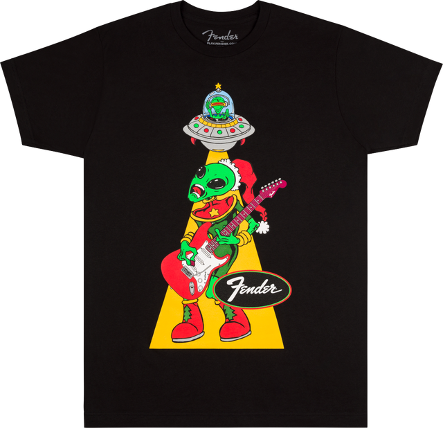The image shows a black Fender t-shirt featuring a whimsical green alien wearing a Santa hat, playing a Fender Stratocaster guitar. The alien is being "abducted" by a UFO via a tractor beam. The classic Fender logo appears below the cartoon-style design. This playful, holiday-themed shirt combines Fender’s iconic guitar branding with sci-fi and festive elements, popular among musicians and guitar fans.