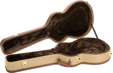 The image shows an open hard shell guitar case with a tan tweed exterior and brown leather trim. It features gold metal latches, a brown leather handle, and a guitar-shaped interior lined with dark plush velvet to protect the instrument. The vintage-style case offers sturdy protection, ideal for safely transporting acoustic or electric guitars, and complements classic or high-end instruments.