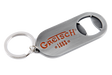 The image shows a Gretsch branded bottle opener keychain with the orange/red Gretsch logo and "1883" marking. It has a brushed metal finish, a built-in bottle opener, and an attached keyring. This promotional item represents the musical instrument company known for guitars and drums, especially hollow-body electric guitars used by artists like Chet Atkins and George Harrison.