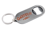 The image shows a Gretsch branded bottle opener keychain with the orange/red Gretsch logo and "1883" marking. It has a brushed metal finish, a built-in bottle opener, and an attached keyring. This promotional item represents the musical instrument company known for guitars and drums, especially hollow-body electric guitars used by artists like Chet Atkins and George Harrison.