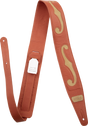 The image shows a high-quality leather guitar strap in rich brown/cognac with tan/cream decorative inlays forming a flowing, ornate pattern. It features detailed stitching, adjustable length with multiple holes, a small "GUITAR" brand label with "Made in Canada" marking, and professional hardware. This premium strap combines functionality with artisanal, handcrafted aesthetic appeal.