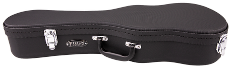 The image shows a black, textured ukulele case with a curved shape. It features silver metal latches, a central black handle, and an oval "TETON" logo with "UKULELES" below. The semi-hard case is designed to protect and transport a ukulele, reflecting Teton’s quality craftsmanship in acoustic string instrument cases.