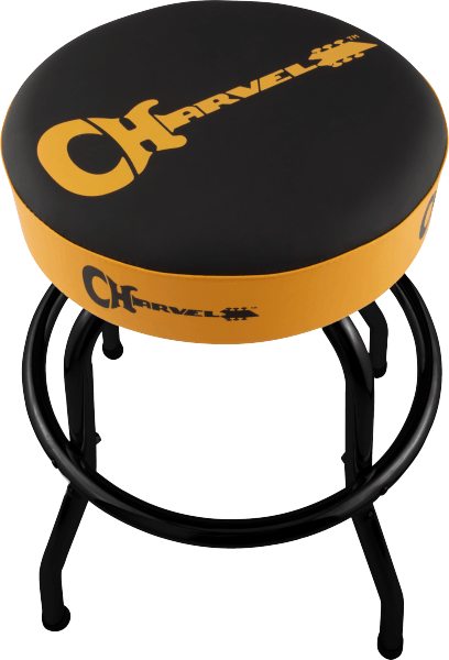 The image shows a round, padded guitar stool with a black cushion featuring the Charvel logo in orange-yellow lettering. It has a matching orange-yellow band around the seat edge and black metal legs typical of guitar stools. Charvel is a well-known electric guitar brand, and this stool provides comfortable seating for guitarists during practice or performance.