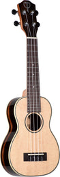The image shows a soprano or concert ukulele with a natural light wood top and darker wood back and sides. It has a round soundhole with decorative rosette, a dark wood neck and fretboard with white dot markers, and a matching headstock featuring black tuning pegs (2x2). The black bridge has white pins, and decorative binding outlines the body. The ukulele features traditional construction and a quality finish.