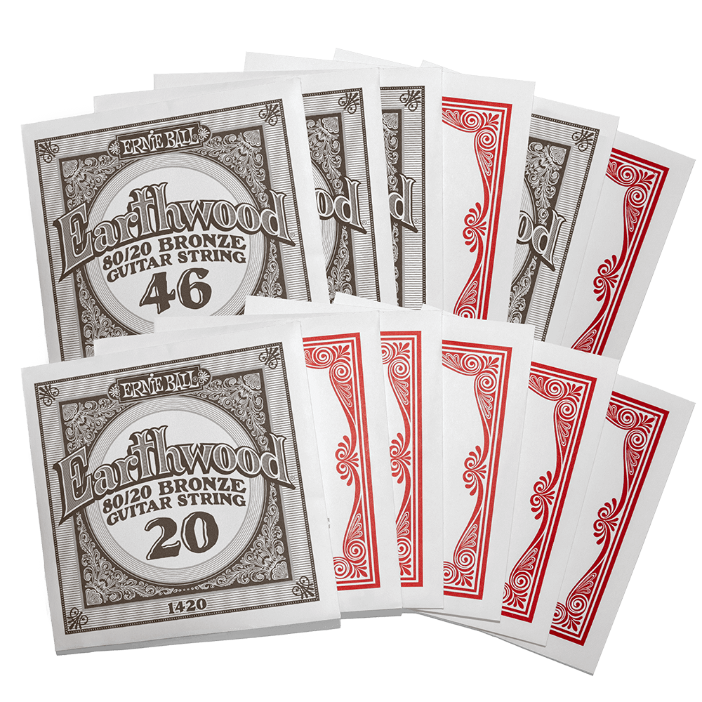 Individually packaged guitar strings with Ernie Ball Earthwood branding on a transparent background