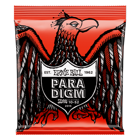 Ernie Ball Paradigm guitar string package with an eagle design on a red background