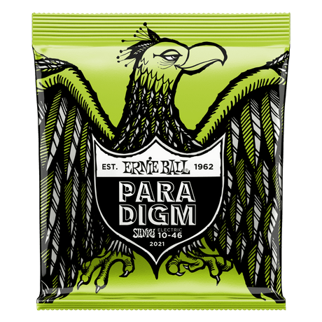 A package of Ernie Ball Paradigm guitar strings with eagle artwork on a green background