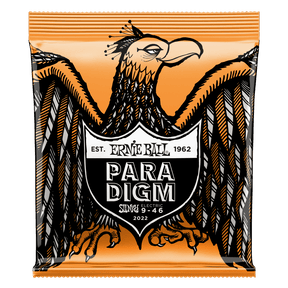 A package of Ernie Ball Paradigm guitar strings with Eagle artwork on an orange background