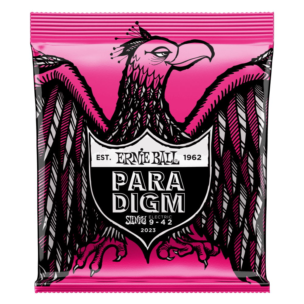A package of Ernie Ball Paradigm guitar strings with eagle artwork on a pink background