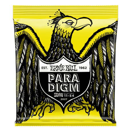 A package of Ernie Ball Paradigm guitar strings with eagle artwork on a yellow background