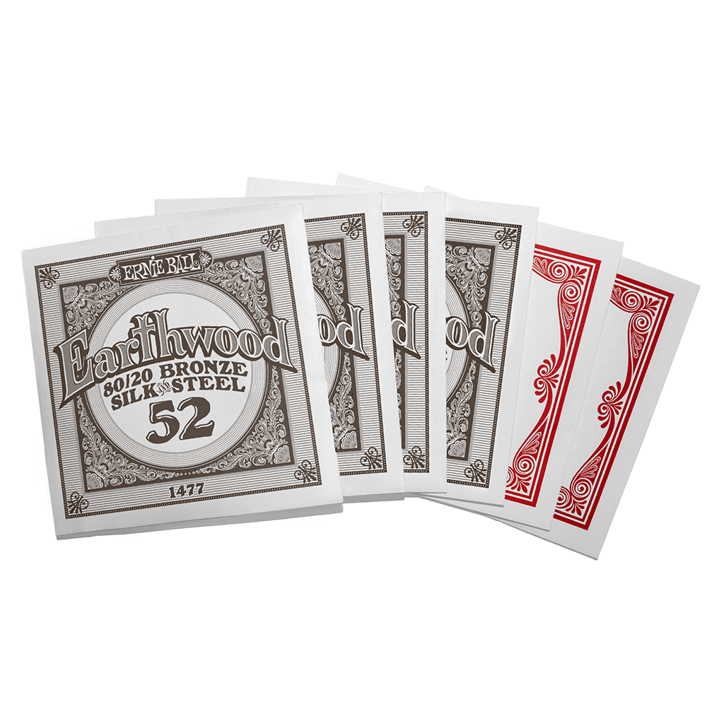 Individually packaged guitar strings with Ernie Ball Earthwood branding on a transparent background