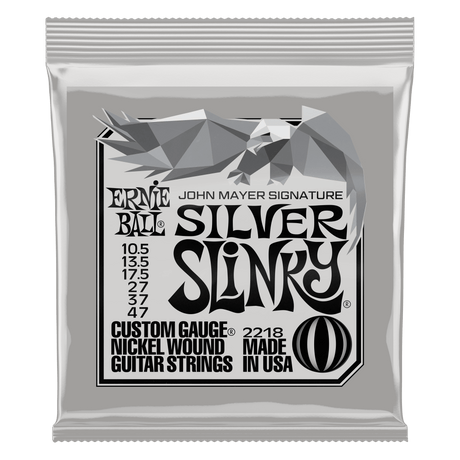 Ernie Ball Silver Slinky John Mayer guitar strings packaging on a white background