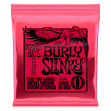 Pink packaging of Ernie Ball Burly Slinky guitar strings with an eagle design.