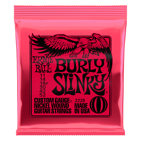 Pink packaging of Ernie Ball Burly Slinky guitar strings with an eagle design.