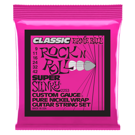 Pink packaging of Ernie Ball guitar strings with black text on a white background