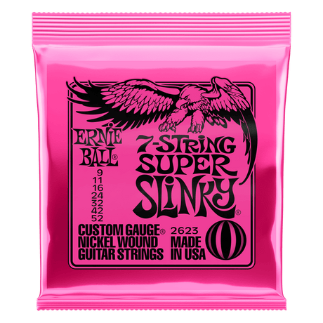Pink packaging of Ernie Ball 7-string super slinky guitar strings with an eagle logo on a white background