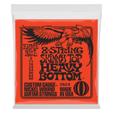 An orange package of Ernie Ball 8-string guitar strings on a white background