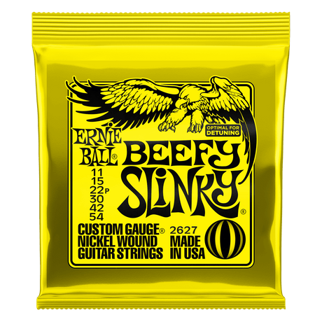 Ernie Ball Beefy Slinky guitar string packaging with yellow background and black text