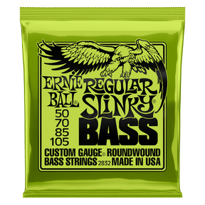 A green package of Ernie Ball Slinky bass strings with black text and eagle artwork