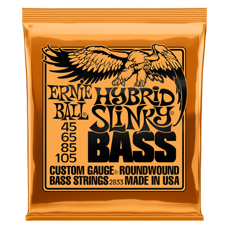 A orange package of Ernie Ball Hybrid Slinky bass strings with black lettering and eagle artwork
