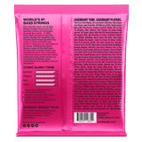 The backside of a pink package of Ernie Ball bass strings with product details in black lettering 