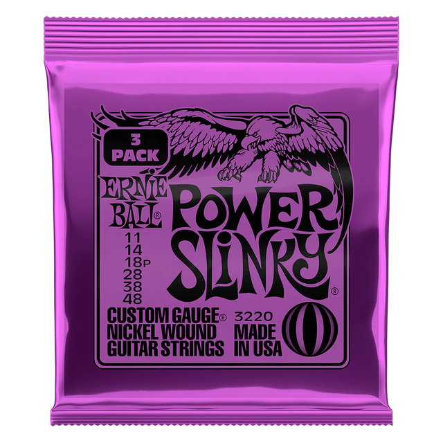 Purple packaging of Ernie Ball Power Slinky guitar strings on a black background