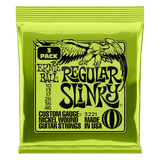 Ernie Ball Regular Slinky guitar string pack on a black background