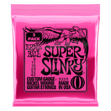 Pink packaging of Ernie Ball Super Slinky guitar strings on a black background
