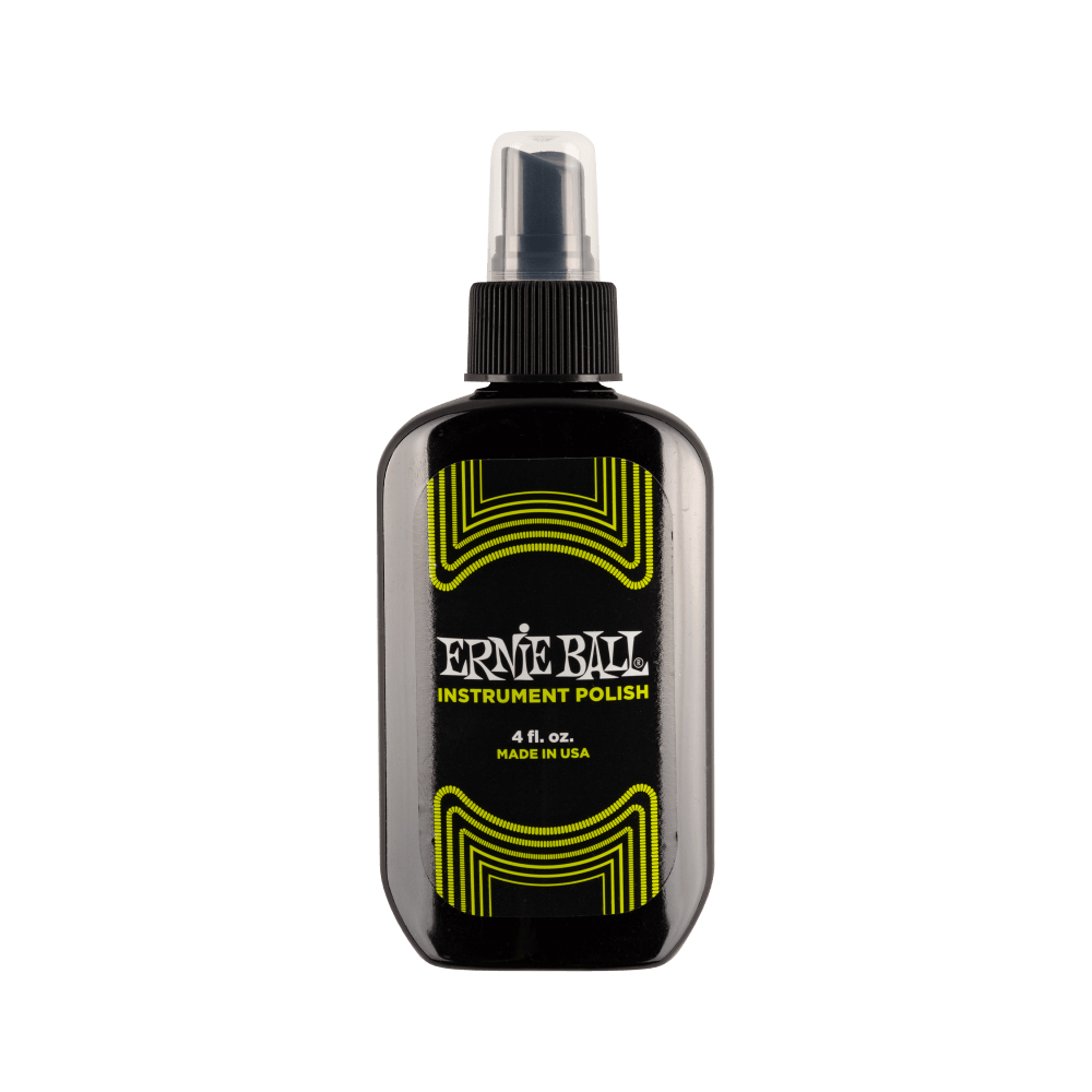Ernie Ball instrument polish bottle on a black background