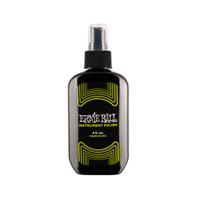 Ernie Ball instrument polish bottle on a black background