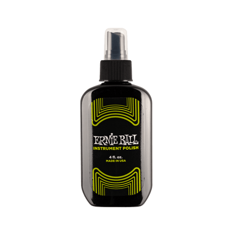 Ernie Ball instrument polish bottle on a black background