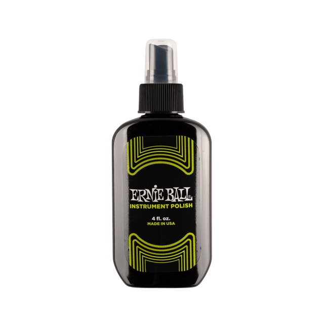 Ernie Ball instrument polish bottle on a black background