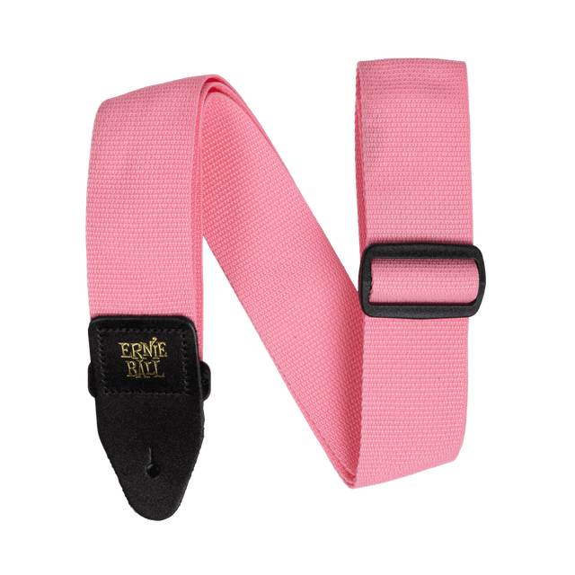 Pink guitar strap with black buckle and gold Ernie Ball logo on a white background